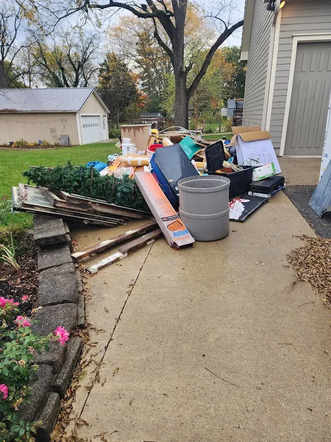 Dumpster being loaded with debris for Commercial Dumpster Rental in Fort Walton Beach